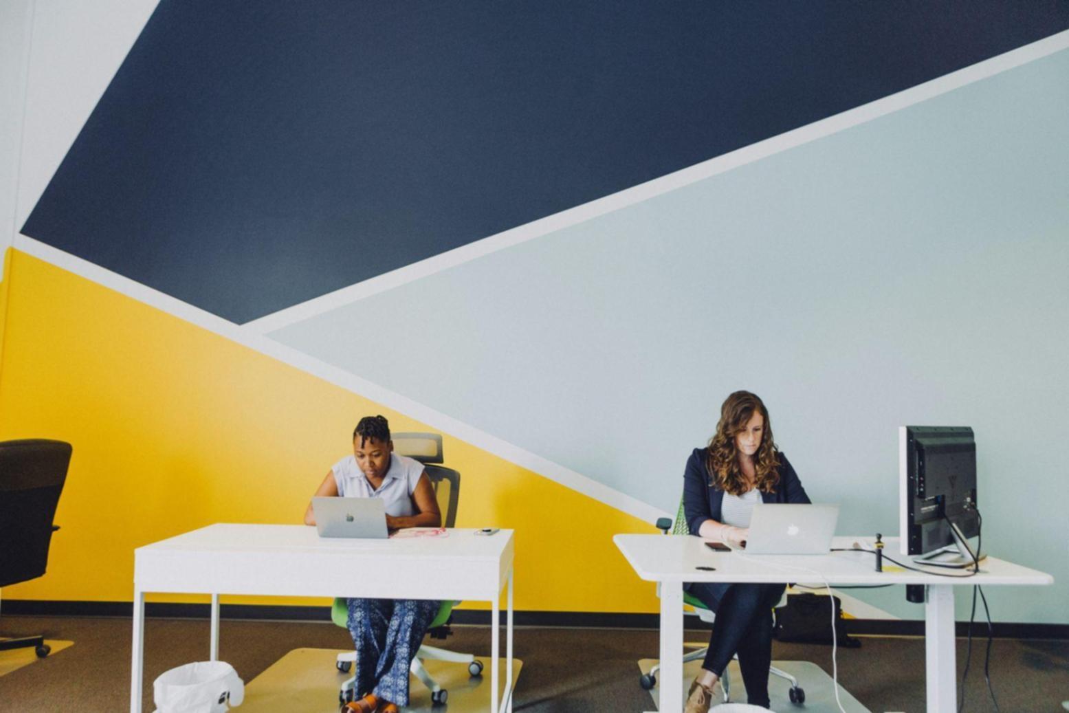 Professional workspace showing budget analysis tools and financial planning materials